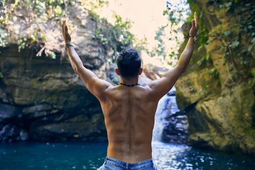 A man practicing self-care and wellness, reflecting on personal confidence.